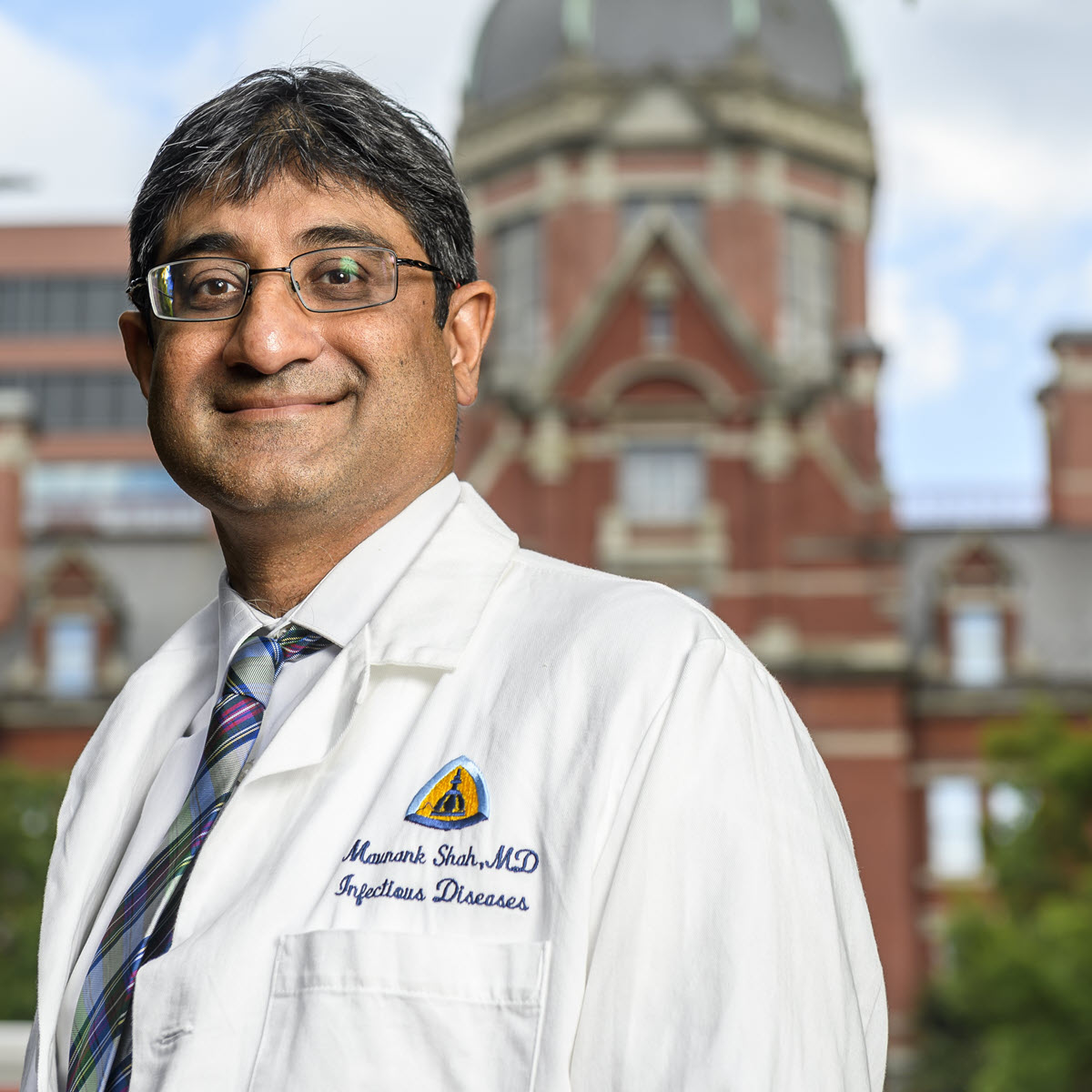 Maunank Shah 2024 TB Champion Maunank Shah smiling wearing a white coat