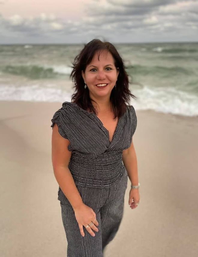 Myrna Leiper Myrna Leiper smiling at the beach, wearing a gray dress