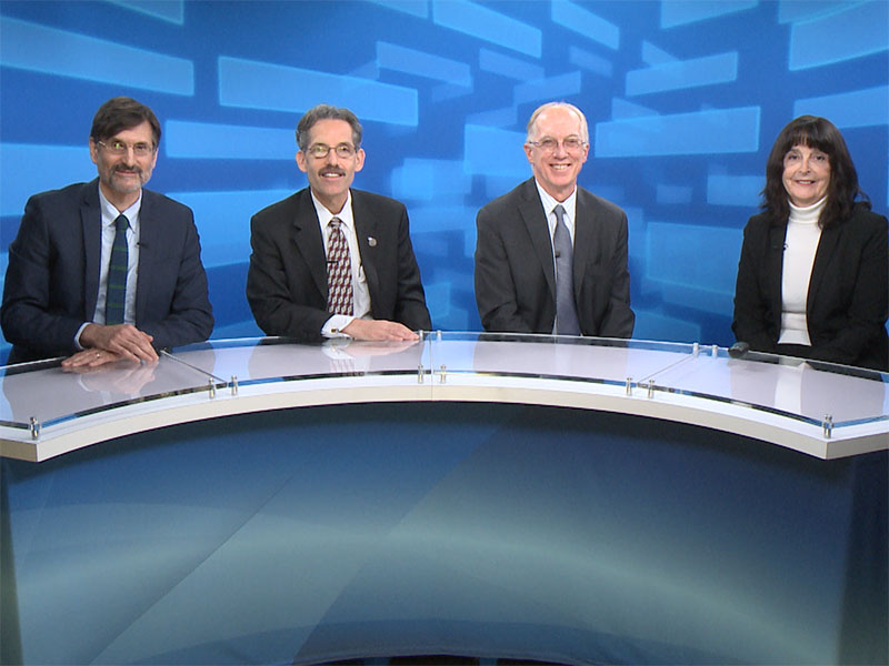 Dr. Farfel, Dr. Prezant, Dr. Crane, and Dr. Ward sitting around a semi-circular desk preparing to discuss Cancer and the World Trade Center Health Program