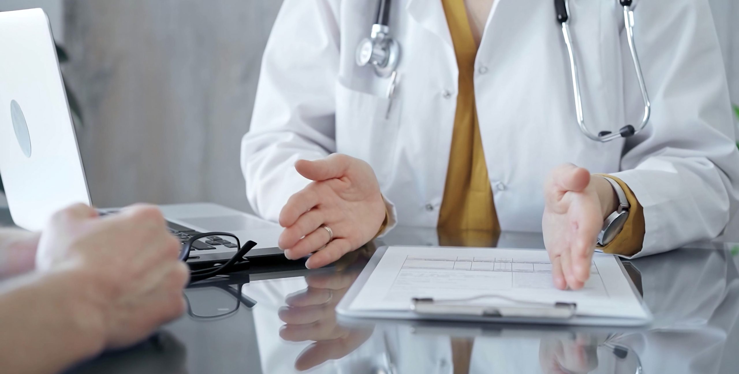Healthcare professional talking to a traveler.