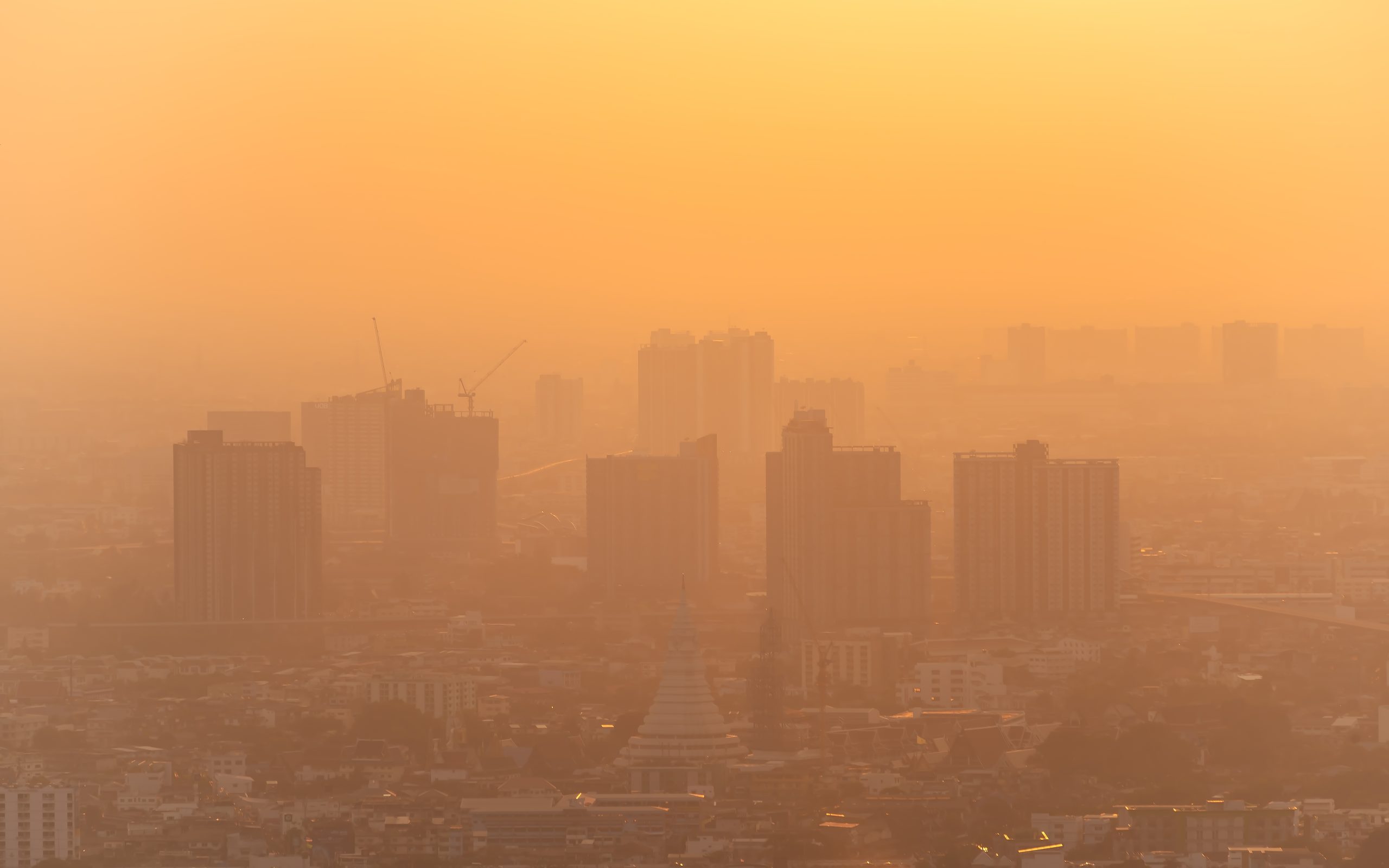 Cityscape with dust in the air making it difficult to see.