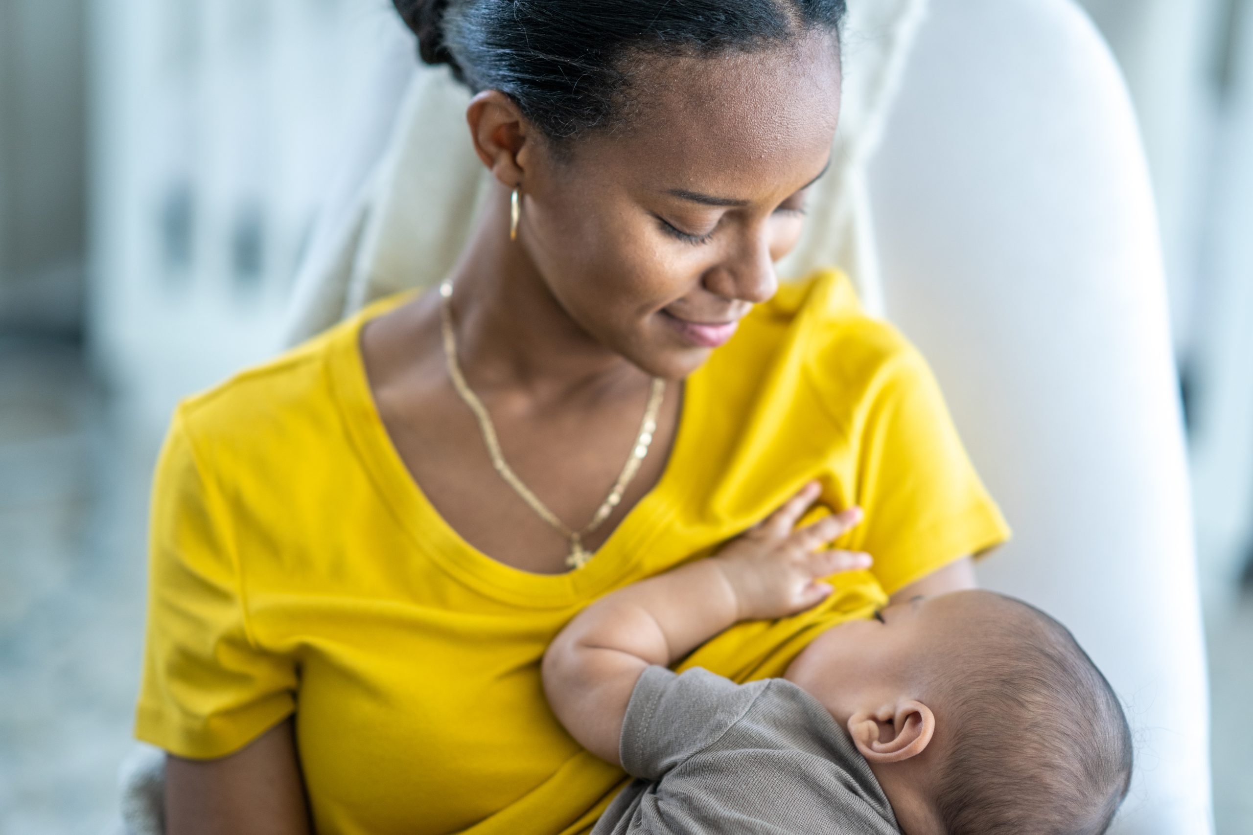 Traveler holding their infant.