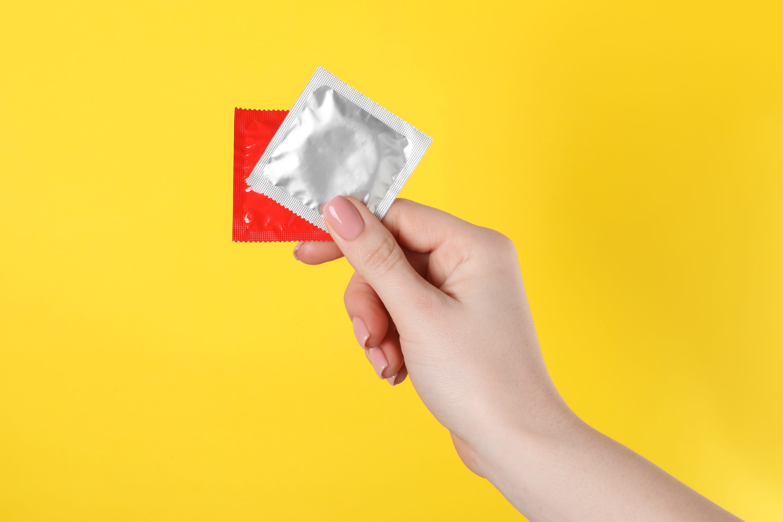 Traveler holding condoms.
