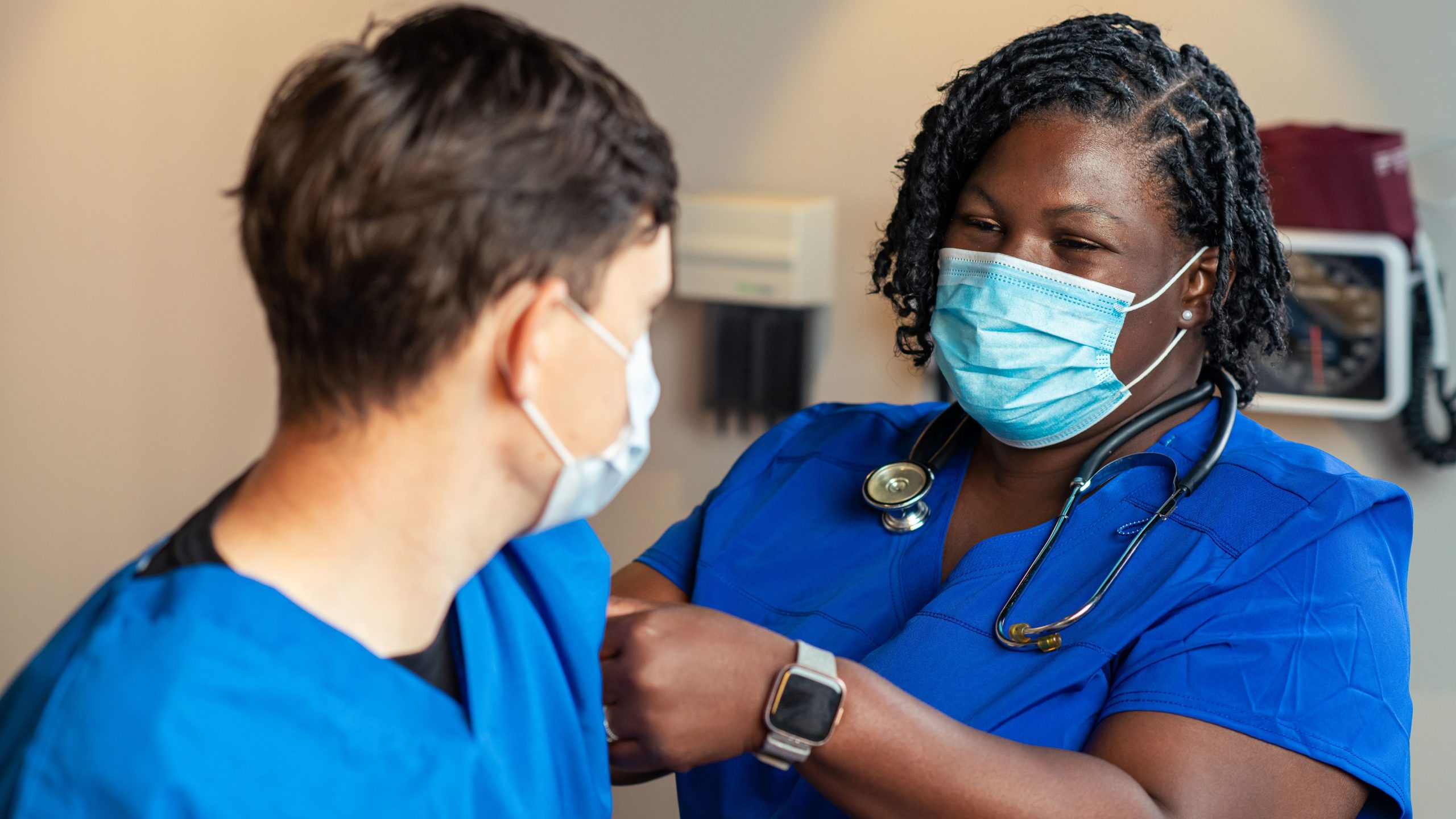 Yf HCP vx Provider putting a bandage on a patient